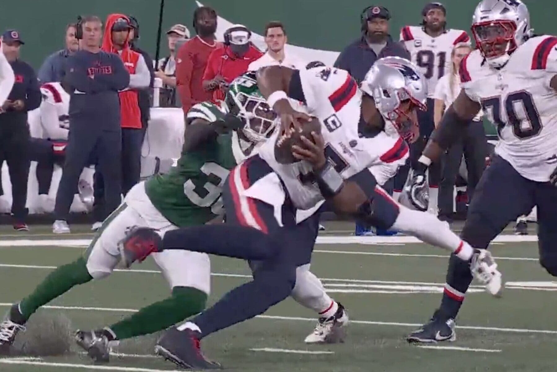 New England Patriots quarterbacks gets sacked on Thursday Night Football against the New York Jets